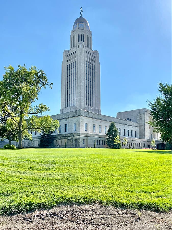 NE Capitol Photo from https://commons.wikimedia.org/wiki/File:Nebraska_State_Capitol,_K_Street,_Lincoln,_NE_-_53708427672.jpg